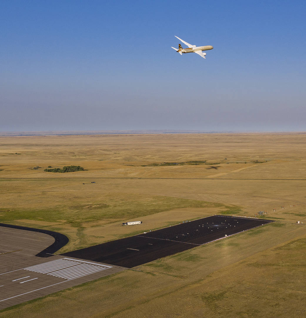 ecoDemonstrator program makes a low pass over a collection of microphones just past the end of the runway at a research facility